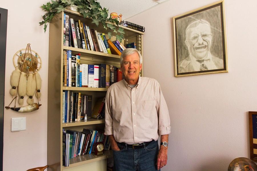 History Professor David Morris is spending a lot of time during his last weeks at City College in his office helping students the week before finals, Wednesday, May 6, in the Interdisciplinary Center on West Campus. Morriss youngest son Dennis Morris, now age 33, drew the picture in 6th grade of Teddy Roosevelt now hanging on his fathers office wall.