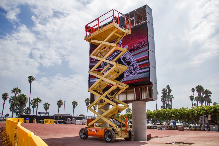 Workers assemble the new video scoreboard on Tuesday, Aug. 25, at City College’s La Playa Stadium.