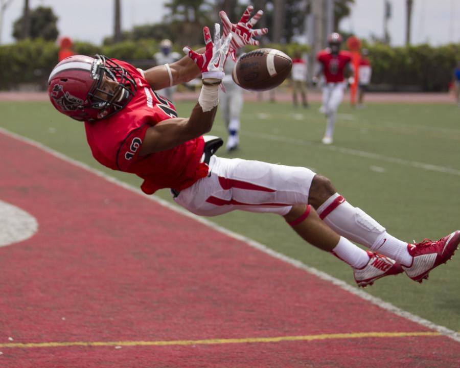 Receiver Elijah Cunningham (No. 13) of City College attempts to make a catch in the end zone Saturday afternoon Sept. 12 at La Playa Stadium. City College beat Hancock, 21-20.