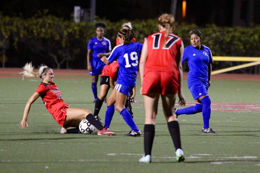 City College defender Morgan Agnor (No. 12) slides to retrieve the ball during the second quarter of the match against Santa Monica College, Friday Sept. 25, at La Playa Stadium in Santa Barbara. Santa Monica beat the Vaqueros, 1-0.