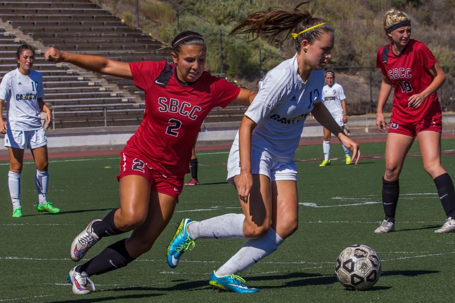 Vaqueros forward Blayne Shoffit (No.2) comes in to steal the ball successfully from Canyons defensive player Kailey Marquez (No. 12) during the first half of the match against College of the Canyons, Friday Sept 18, at La Playa Stadium. City College walked away with 1-0 for its fourth win of the season out of five games.