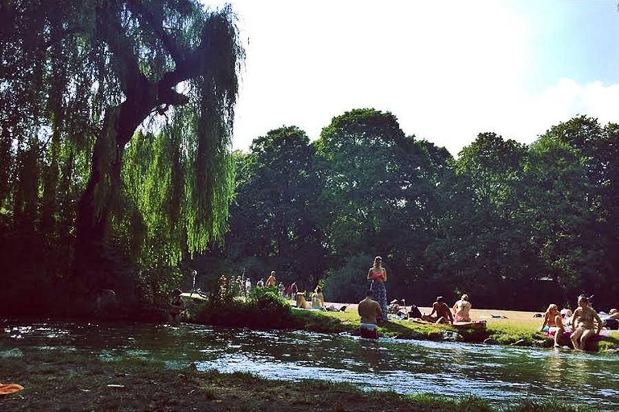 The Eisbach river flowing through the English Garten in Munich, Germany in August.