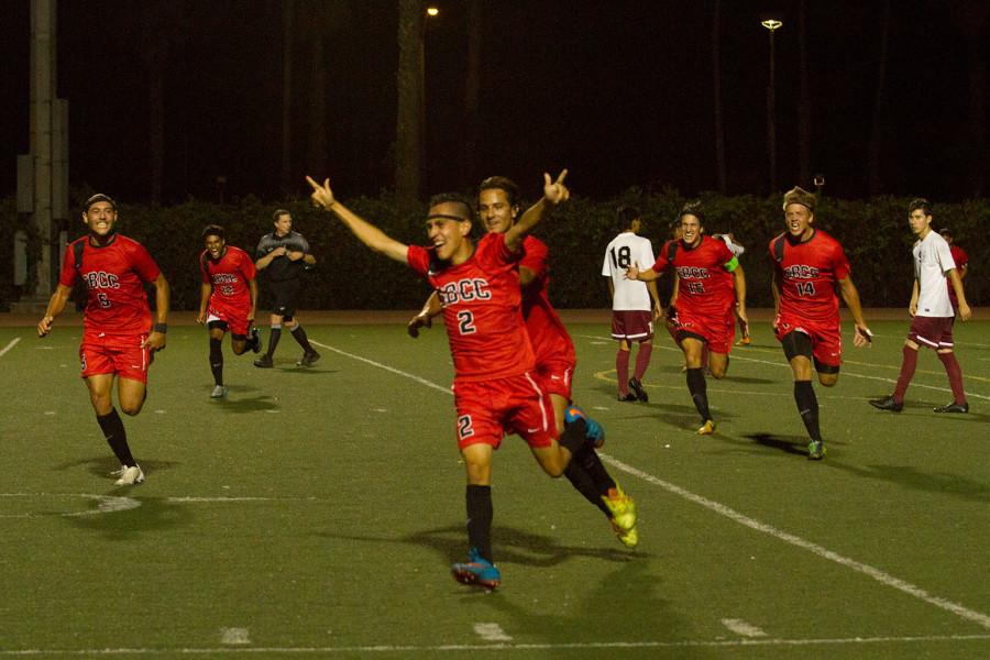 The Vaqueros celebrate a goal scored by sophomore Jonathan Mora (No. 2) in the final minutes of the game against El Camino-Compton College, Tuesday night Sept. 8, at La Playa Stadium in Santa Barbara. City College beat Compton 1-0.