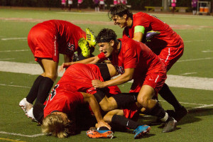 City College Vaqueros celebrate sophomore Jonathan Mora (No. 2) scoring a goal in the final minutes of the game against El Camino-Compton College, Tuesday night Sept. 8, at La Playa Stadium in Santa Barbara. City College beat Compton 1-0.