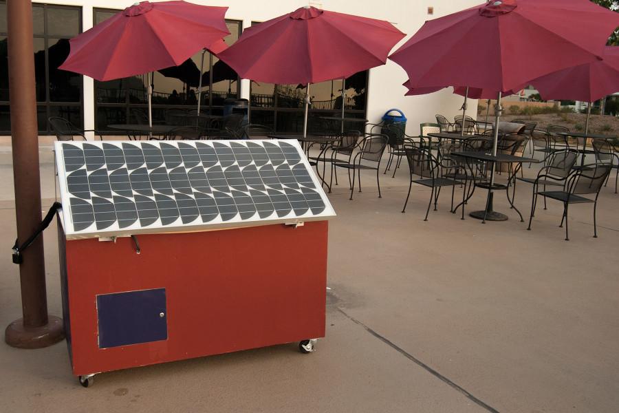 The City College Energy Collective Club’s latest project, a solar powered cell phone charging cart, sits on the Campus Center patio for public use, Friday morning Sept. 11, on East Campus. The cart was built by the club members and took two years to complete.