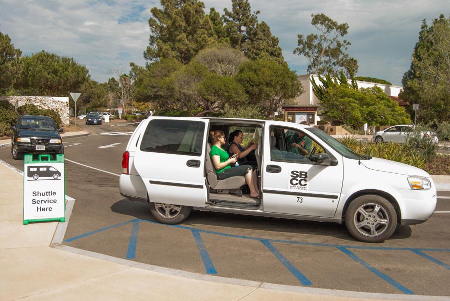 A free park-and-ride shuttle van headed to the Wake Campus carries student Amanda Probst (left), Culinary Arts staff Kaylene Thomas, and driver James Chambliss Thursday, Sept. 10 on East Campus. Two shuttle vans circulate daily from the Wake Campus and the Garden Street parking lot as part of SBCC Commute program's effort to popularize sustainable transportation and reduce on-campus parking.
