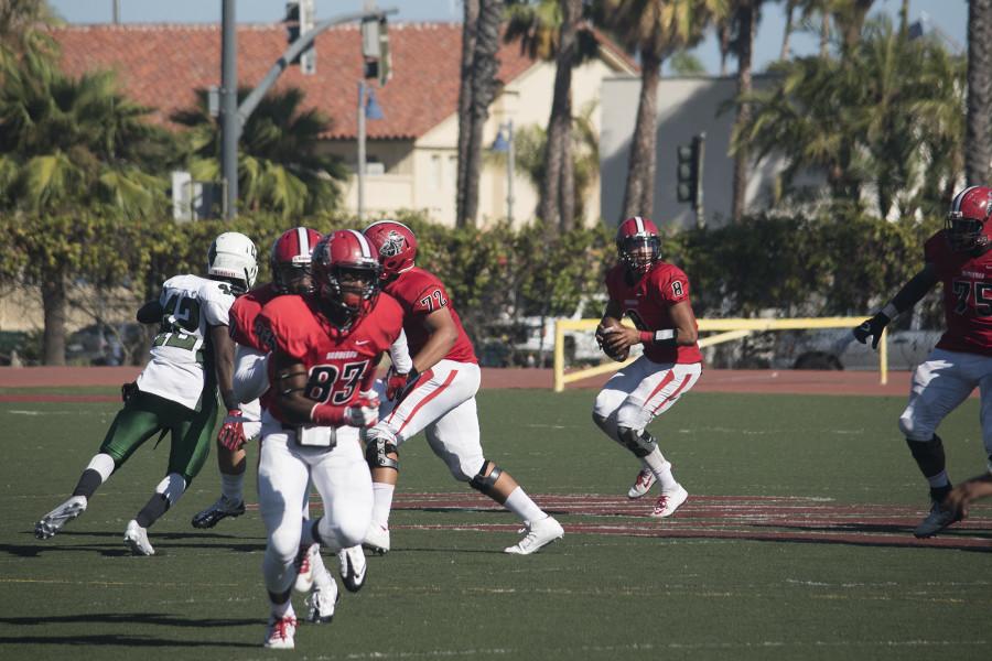 Vaqueros quarterback Brandon Edwards (No. 8) drops back against East LA on Saturday Sept. 19 at La Playa Stadium. They would fall short on their comeback effort.