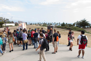 Students passing by the Project Truth anti-abortion outreach stop and gather to hear debates and to discuss opinions on the subject, Thursday afternoon, Oct. 15, on West Campus.