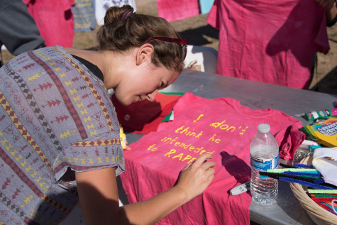 Rachel Bourke, city college student and feminist club member, puts the finishing touches on a t-shirt for the SBCC 2015 Clothesline Project, Monday morning, Oct. 26, in the Friendship Plaza on East Campus. The Clothesline Project is an effort to raise awareness about sexual violence and is presented by Student Health and Wellness and City College Connect, with participation from the Feminist Club, the Rape Crisis Center, the Health and Wellness Center and the Pacific Pride Foundation.