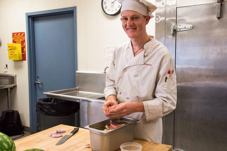 Peter Wolfgram, a City College culinary arts student, demonstrates the correct method of preparing watermelon, Thursday, Oct. 8, in Campus Center Building Room CC108 in the School of Culinary Arts.