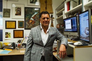 Michael Gallegos, associate professor in the multimedia arts and technology department, is an avid diver and underwater photographer, Tuesday, Nov. 10, in his office on East Campus at City College. Gallegos has traveled the world taking photographs, some of which hang in his office.