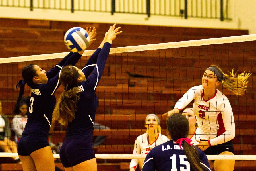 Middle blocker Hannah Cantrell (No. 2) finishes the second set at 25-22 against Los Angeles Mission College, Wednesday, Nov. 18, in the Santa Barbara Sports Pavilion. The Vaqueros beat the Eagles, 3-0.