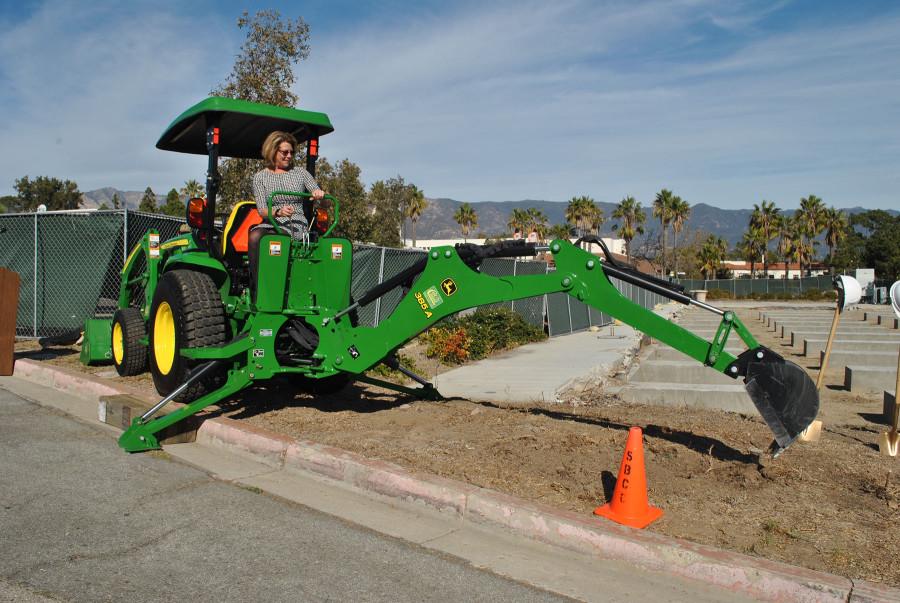 Superintendent-President Dr. Lori Gaskin operating a backhoe during the groundbreaking ceremony for a future West Campus Classroom Building, Wednesday, Dec. 2, at City College. Photo courtesy of Joan Galvan.