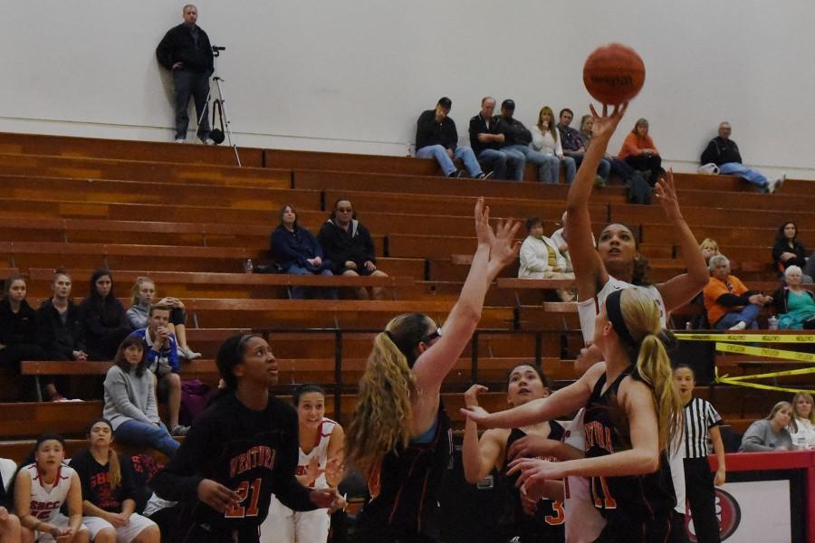 Detinee King (No. 25) shoots for two of her 21 points amongst a sea of Ventura Pirates at the Sports Pavilion on Saturday, Jan. 23. The Vaqueros fall to 11-10 on the season and the Ventura Pirates remain undefeated.