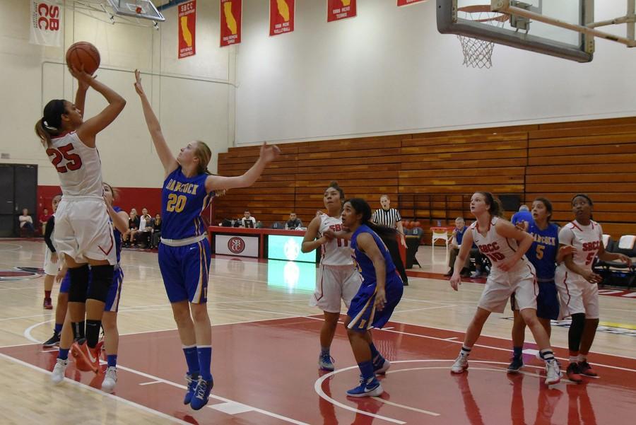 Vaquero freshman Destinee King (no. 25) shoots over Allan Hancock Forward Michaila Miller (no. 20) for two of her 18 points in City College’s win against the the Bulldogs on Saturday, January 30, in the Sports Pavilion.  City College improved to 4-3 in conference play and 13-10 overall.