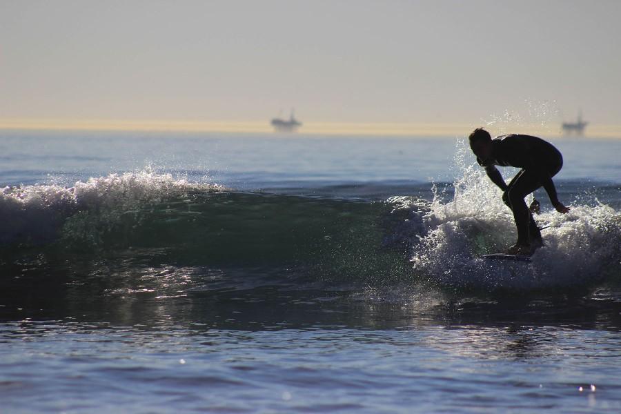 Estiban Belikan drops in on his fifth wave of the morning during his surfing class on Tuesday, Feb. 16, at Leadbetter Beach in Santa Barbara.