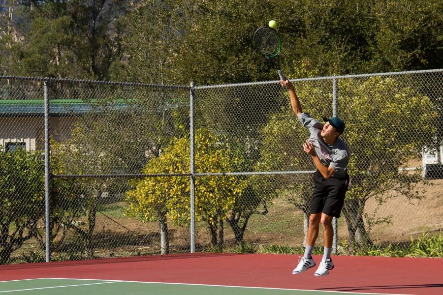 Vaqueros’ tennis team member, Andrew Tufenkian, a graduate from Dos Pueblos High School, demonstrates the agility and power of his serve during a preseason warm up match with Westmont College on Tuesday, Jan. 26. Andrew is a transfer student from Cal Lutheran University, returning to his home town after hearing that Santa Barbara City College, was fielding a tennis team after a three year hiatus from intercollegiate competition.