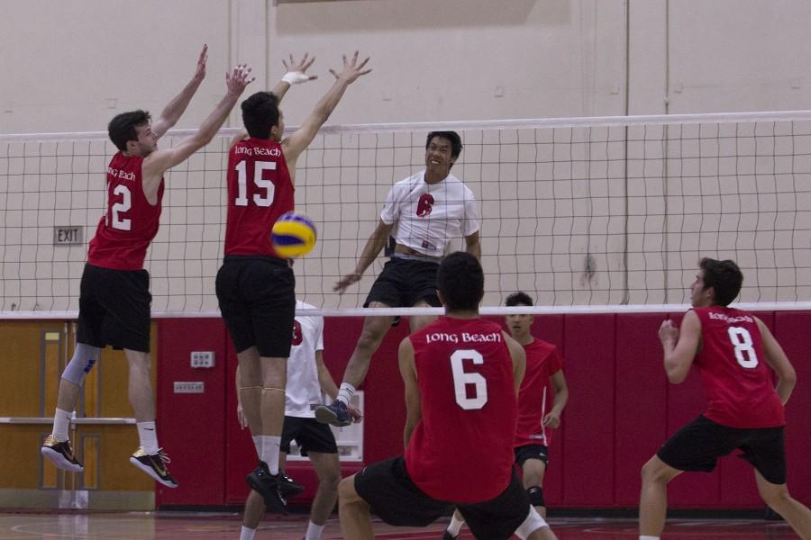 Vaquero Matt Hall (No. 6) attempts to spike the ball and gets past the Long Beach City College Vikings Jacob Branch (No. 11) and Travis O'Gorman (No. 12) but the play is blocked by Andrew Pearson (No. 6) who volleys the ball up to score on Wednesday March 2, in the Sports Pavilion. The Vikings defeated the Vaqueros, 3-1.