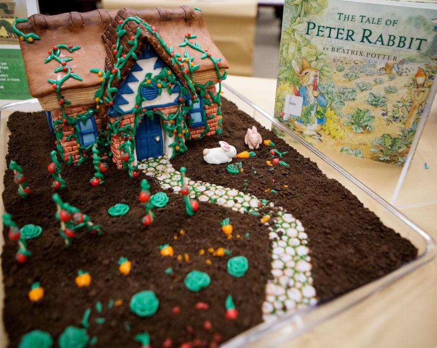 Lauren Peikert, 24, wins with her rendition of the “Tale of Peter Rabbit” at the 6th Edible Book Festival on Wednesday afternoon, March 23, in City College's Luria Library. Peikert’s cake won Best representation of scene, line, character, or theme of a book, as well as winging People’s Choice and took the cake for Best in Show.