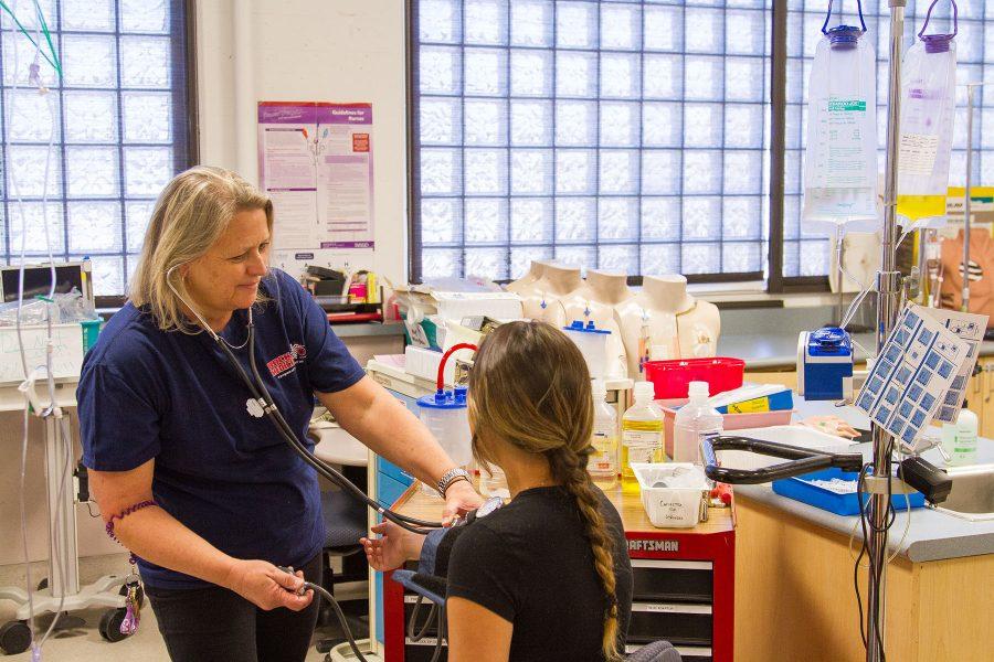 Cathy Schermer, nursing instructor at Santa Barbara City College, demonstrates the proper technique for checking a patient’s blood pressure in the nursing school lab on Thursday, April 28, at Santa Barbara City College. Schermer is a volunteer nurse for Rock Medical, which supplies non-judgmental medicine for events like Burning Man in the California desert and Lucidity at Live Oak campground off of San Marcos Pass in the Santa Ynez Valley in Santa Barbara County, Calif.