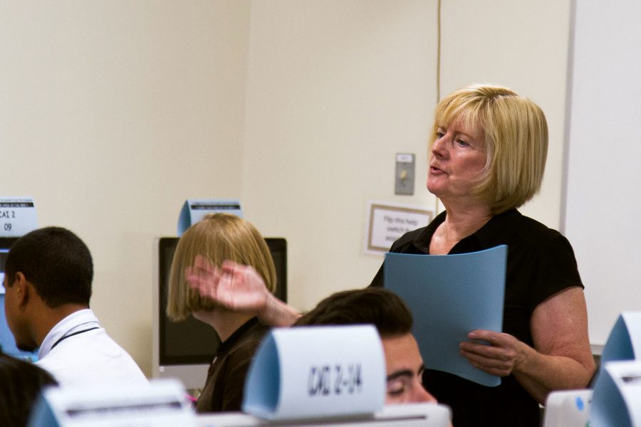 City College English professor, Kathy Molloy, helps accelerated English 100/110 students prepare for their final portfolio projects on Tuesday, April 6, in the Cartwright Learning Resource Center tutor labs at City College in Santa Barbara. Molloy was this year’s California Area C recipient. Recipients of the Hayward Award receive a plaque and a $1,250 cash award.