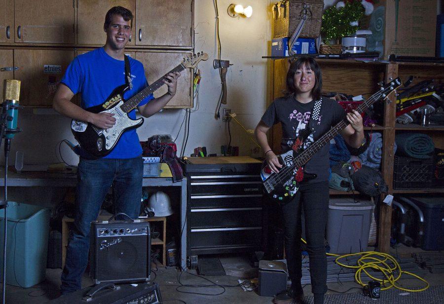 The band “Gloom Me” consisting of Ethan Jones, lead guitarist and vocalist, and bassist Stephanie Luna practice new songs on Tuesday, April 12, in Luna’s garage in Goleta. The Pokemon ska alternative hardcore band originated from a band lottery at the Funzone. Not shown is band member Sydney Hengst.