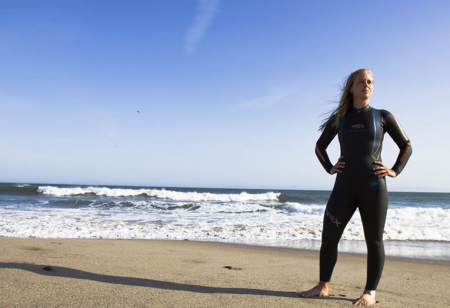 City College swimmer Kristina Hill stands on the beach on Thursday, April 14, at Leadbetter Beach, Santa Barbara. Hill not only broke the school record in the 1000 yard freestyle at the last conference, but she has previously won the open water race, Escape from Alcatraz.