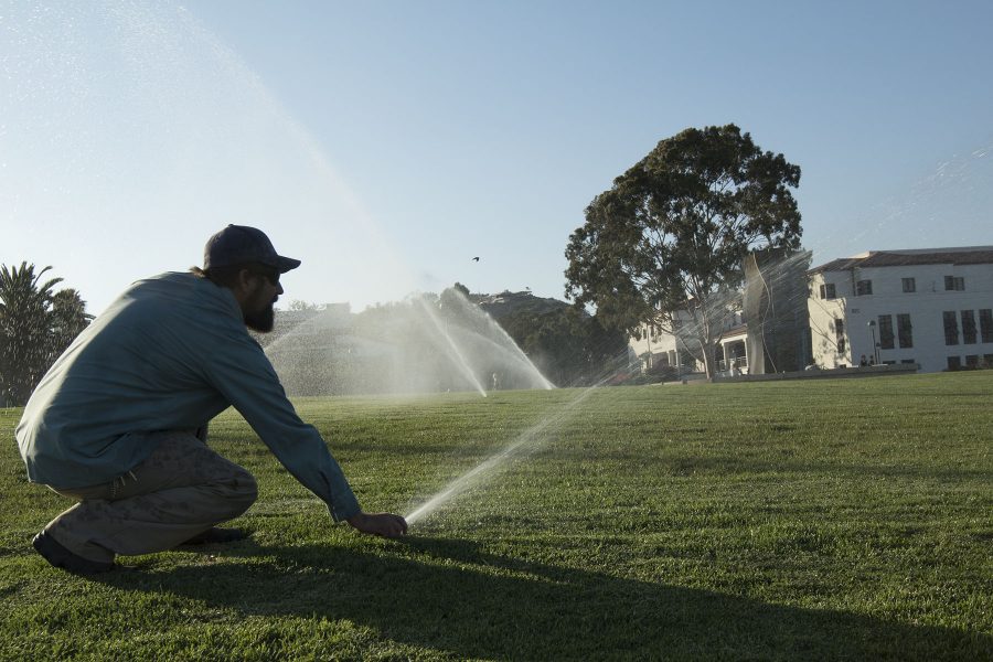 Mark Broomfield, ground maintenance supervisor for City College, demonstrates the daily recycled-water routine on Thursday, Sept. 8, on the West Campus lawn. The sprinklers normally go off on a timer around four a.m. before students arrive for their classes.