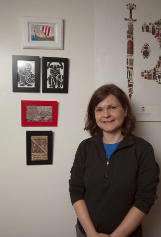 Tara Carter stands by images of island Vikings on Thursday, Sept. 8, in her office at City College. Carter, an island anthropologist, was recently hired as a full time instructor in the anthropology department.