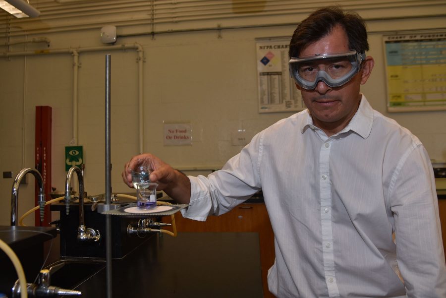 Juan Carrera-Espinoza combines two solutions in a chemistry lab on Tuesday, Aug. 30, in the Physical Science Building on City College’s East Campus. Carrera-Espinoza started at City College taking non-credit courses in chemistry as a student and is now a full-time instructor.