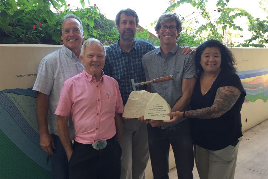 Faculty members (from left) Kevin McNichol, Robert Gray, Jeff Meyer, Bill Dinklage and Eiko Kitao stand with the award bestowed upon the City College Geology department.