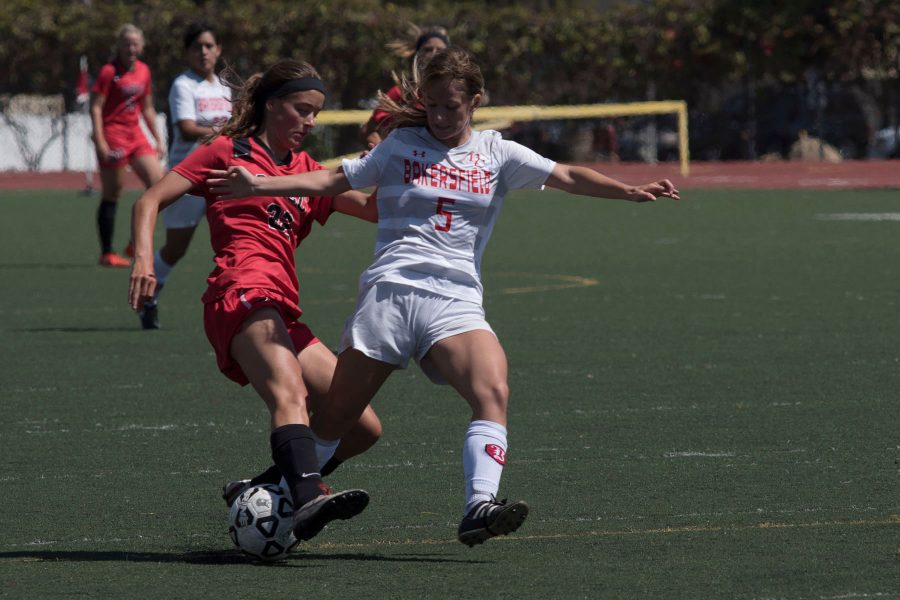 Bakersfield College defender Alexis Goyeneche (No. 5) stops City College midfielder Fee Van Deelan (No. 22) during a breakaway on Tuesday afternoon, Sept. 13, at La Playa Stadium. The Vaqueros defeated the Bakersfield Renegades 4-1.