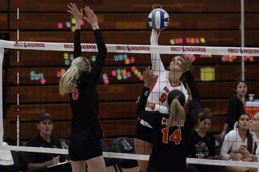 Kaylene Ureno (No. 9), City College Vaquero right side hitter, successfully spikes the ball against the Citrus College Owls on Wednesday, Oct. 12, in the Sports Pavilion. The Vaqueros defeated the Owls 3-0.