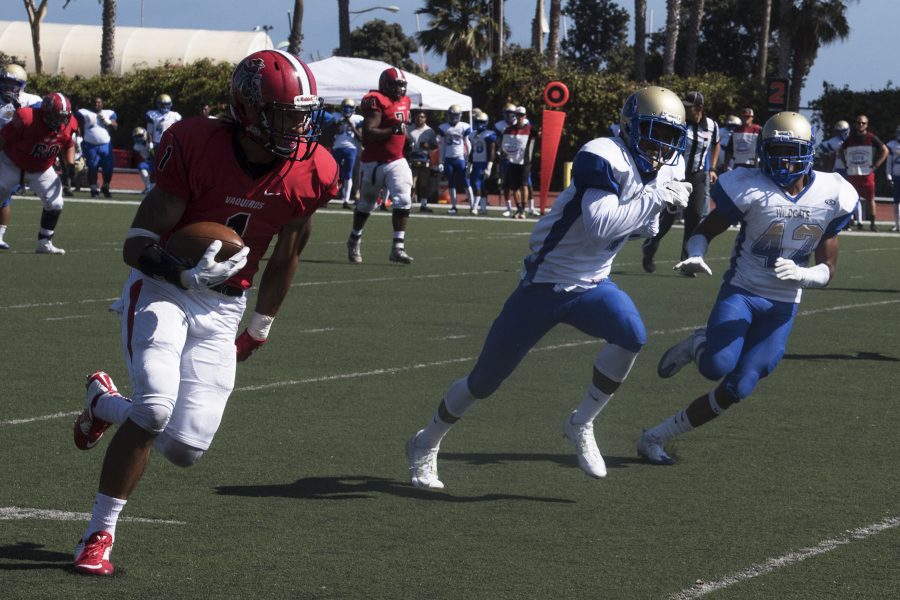 Elijah Cunningham runs past West Los Angeles College defenders to score a touchdown on Saturday, Sept. 10 at La Playa Stadium. Cunningham is an explosive receiver, kick and punt return specialist and nephew of Philadelphia Eagle Hall of Fame quarterback Randall Cunningham.