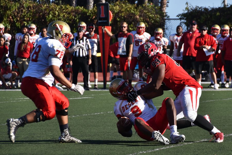 Vaquero defensive lineman Luigi Dorzin (no. 93) sacks De’Abrie Smith (no. 9), College of the Desert quarterback, for a 13-yard loss on Saturday, Oct. 1, at La Playa Stadium. The Vaqueros defeated the Roadrunners, 47-18.