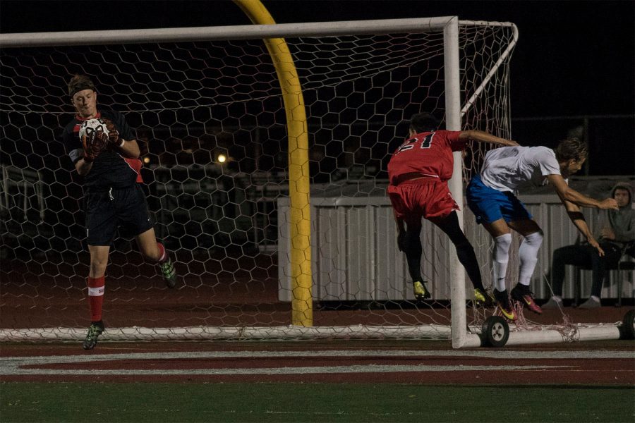 Vaquero goalkeeper Shane Pitcock (No. 1) makes a save after Corsair forward Romario Hulea (No. 9) attempts a shot on goal on Tuesday, Oct. 25, at La Playa Stadium. City College defeated Santa Monica College, 2-1, and improves to 8-6 overall and 3-2 in league play.