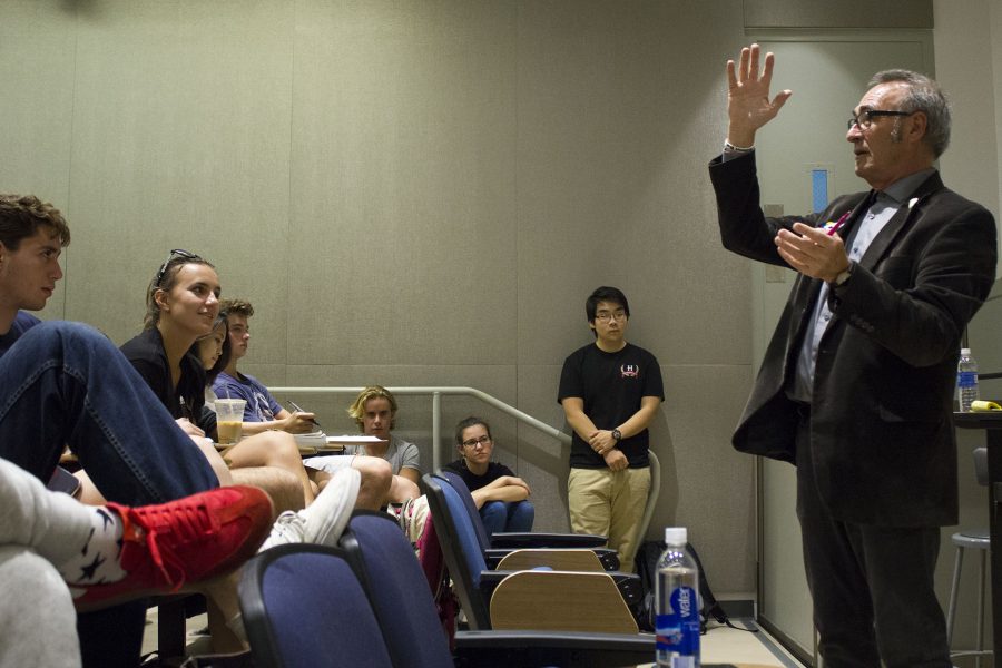 Philosophy Professor Joe White debates Environmental Science Professor Adam Green on morality during the annual Prof-Off on April 14. White will be retiring at the end of this semester.