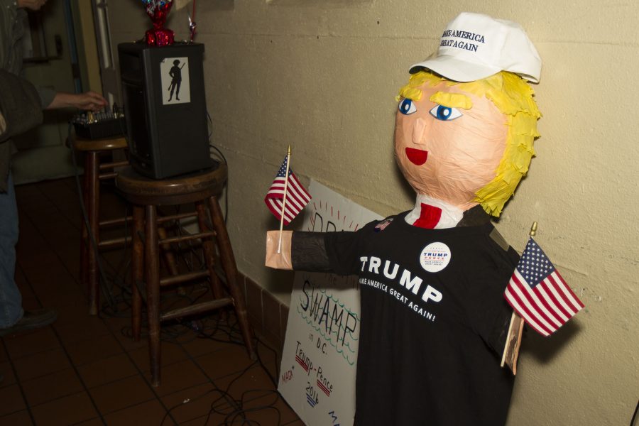 A Donald Trump pinata sits under the television broadcasting live election updates on Tuesday evening, Nov. 8, at The Endless Summer bar-cafe during the Young Republican election party in Santa Barbara. The President of the Young Republicans, Bobby Mercado said “I didn’t think it was going to happen,” about Donald Trump winning the presidency.