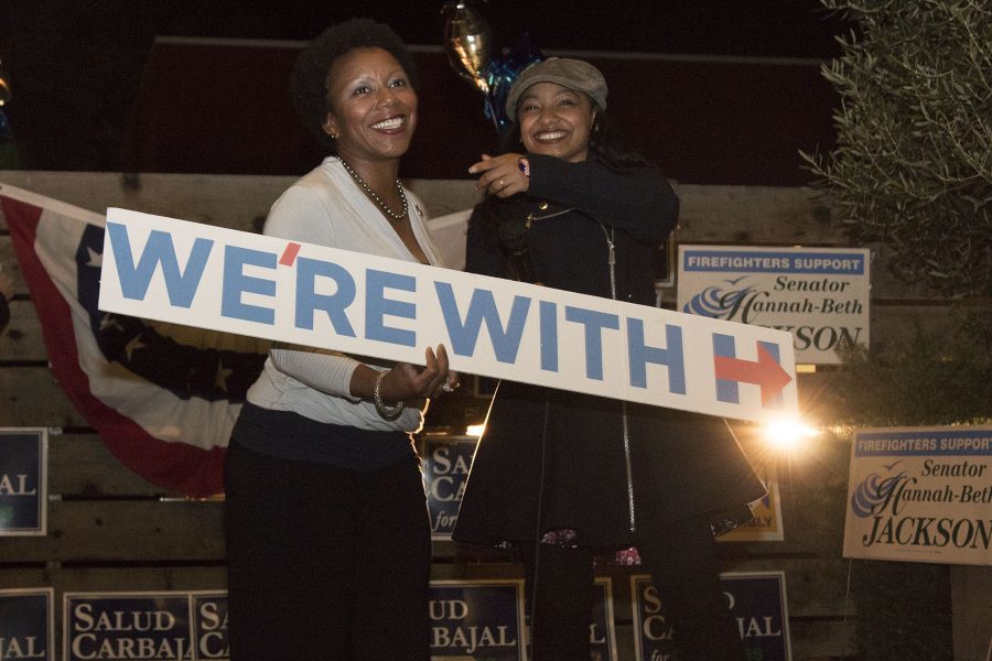 Charlotte Gullap-Moore (left) and Breyanna Carter show their support for Clinton at the Democrat election party on Tuesday, Nov. 8, at The Mill Restaurant and Brewery in Santa Barbara. “If you say that Trump is in the best interest of our Country then you are in a warped reality,” says Gullan-Moore.