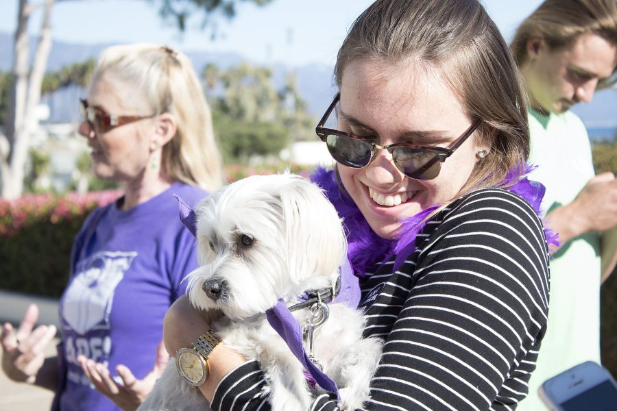 Student Nathalie Bergstroem holds Molly, a therapy dog, in front of the Luria Library on Tuesday, Nov. 29, at City College. Bergstroem had a special connection with Molly and was reluctant to set her down.