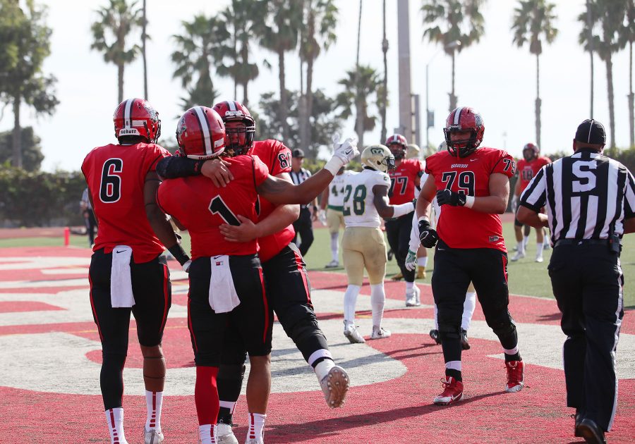 Sophomore Elijah Cunningham (No.1) celebrates with his teammates after a touchdown in the second quarter against LA Valley on Nov. 12, at City Colleges La Playa Stadium. The Vaqueros lost the game 47-35.