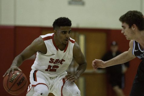 City College Vaquero Drayten Howell (No. 12), and Moorpark Raider Jake Todey (No. 20) make their way across the court on Wednesday, Jan. 25 at the Sports Pavilion. The Vaqueros defeated the Raiders 65-63.