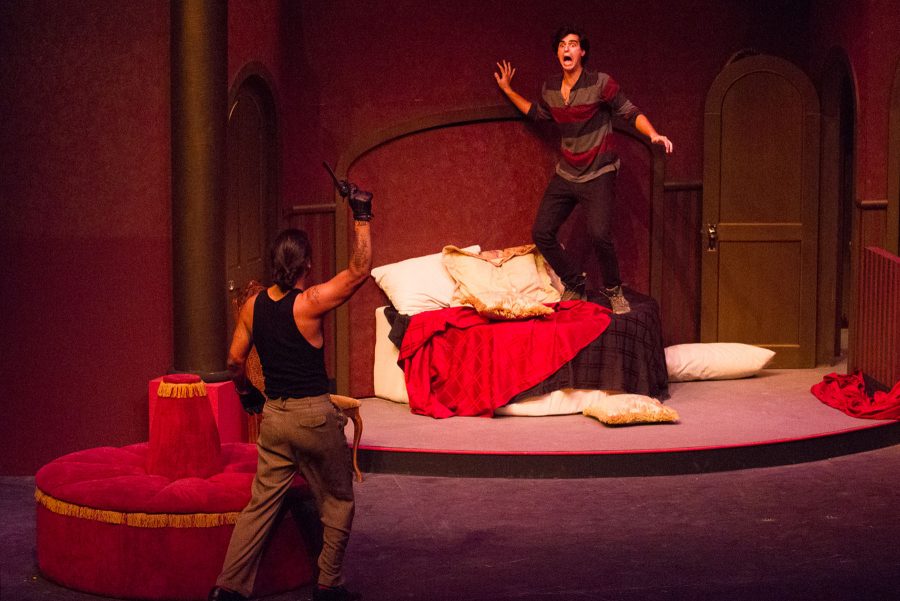 Pacomio Sun (left) and Stefan Wayne perform a dramatic scene during the stage crew viewing of ‘A Flea in Her Ear’ on Tuesday, Feb. 21, in the Garvin Theater at City College. This R. Michael Gros production, will run from March 1 to 18.