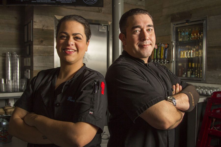 Lead Cook Marika Millner and Gabriel Ibarra, head chef and kitchen manager at Mesa Burger, are alumni of the City College culinary arts program on Monday, Jan. 30, 2017 at Mesa Burger in Santa Barbara. Ibarra tries to hire people from the program, ‘I look at them as my brothers and sisters,’ said Ibarra ‘I have a soft spot in my heart for the culinary program.’
