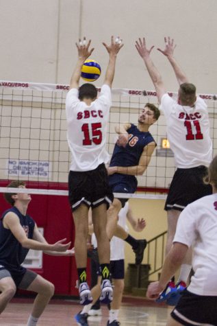 City College Vaqueros, Jarret Futch (No. 15) and Sean Reynaert (No.11) attempt to block a kill by Orange Coast College Pirate, Jordan Hoppe (No.16) on Wednesday, Feb. 8, 2017, in the sports pavilion at Santa Barbara City College. According to Futch, the Vaqueros have not beaten the Pirates in a set in four or five years.