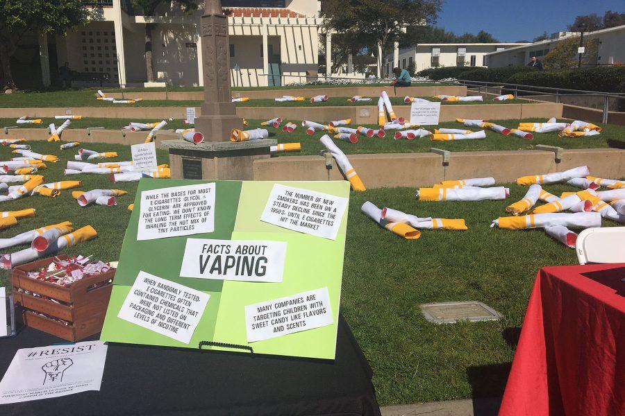 Oversized cigarettes littered on the ground demonstrating butt pollution as a part of “Kick Butts Day” on Wednesday, March 15, at the Friendship Plaza at City College. The event is meant to inform students about tobacco and related products.