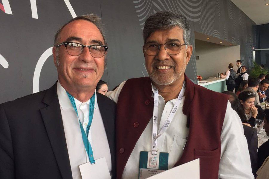 Kailash Sathyarthi, nobel peace laureate 2014, and Philosophy Professor Joseph White at the 16th World Summit of Nobel Peace Laureates in Bogota, Colombia.