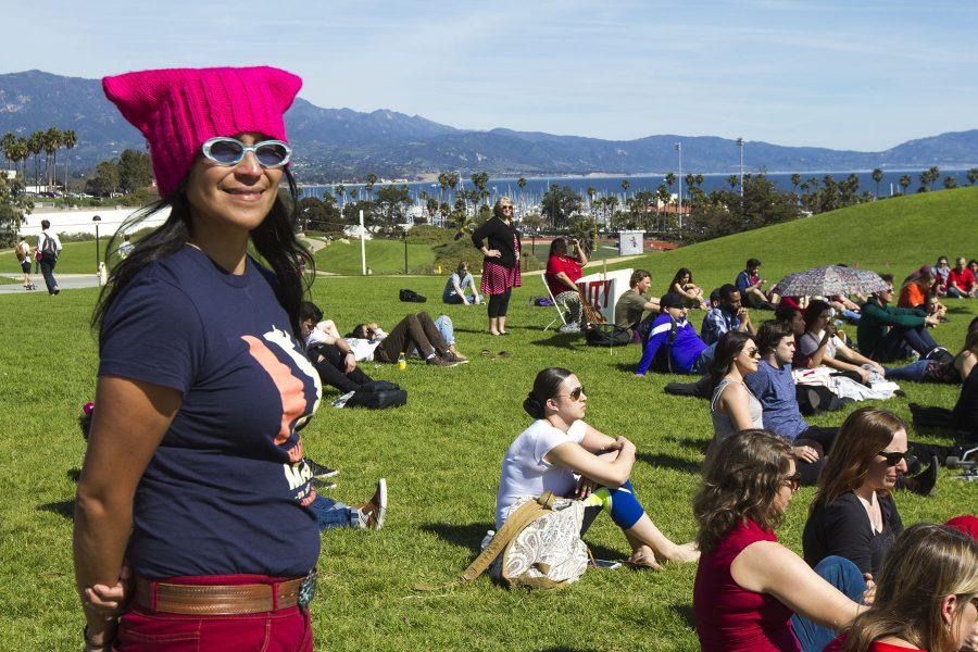 English Professor Melissa Menendez attends the “International Women’s Day: A Day Without Women!” event on Wednesday, March 8, on the West Campus Lawn. Mendez coordinated the event and more than 30 people spoke on various topics including women’s rights, immigration, and LGBT rights.