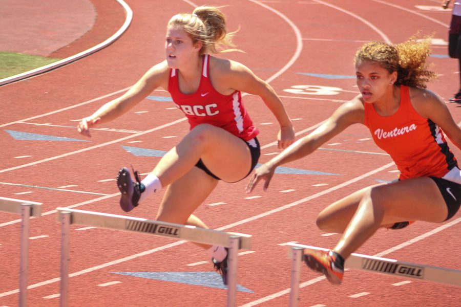 Madison Blaes hurdles in the 100 meter hurdle at the City College Easter Open track meet on Friday, April 14, at La Playa Stadium. Blaes finished 15th overall with a time of 18.42 seconds.