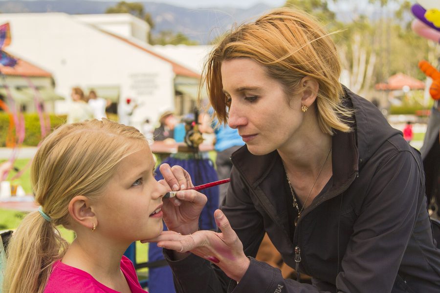 Madison Bryson, 9, has her face painted by Stephanie Mings at the Santa Barbara Kite Festival on Sunday, April 9, on West Campus at City College.